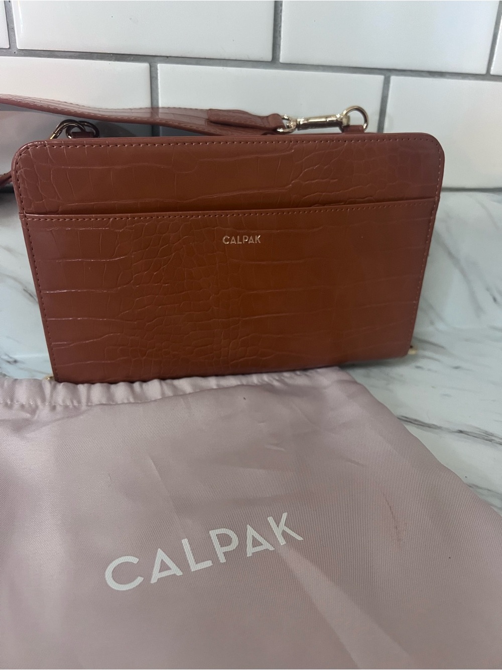 Calpak Croc-Embossed Wristlet in Cognac Brown